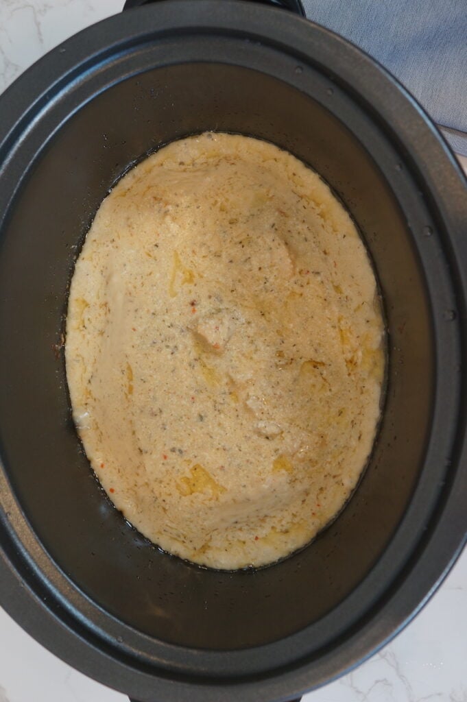 Step 7 - Remove chicken from crockpot and shred. Put shredded chicken back in crockpot and stir