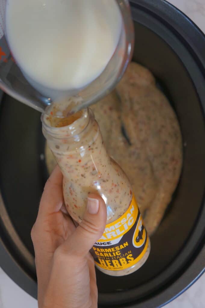 Step 3 - Pour milk into bottle. Shake and pour into crockpot