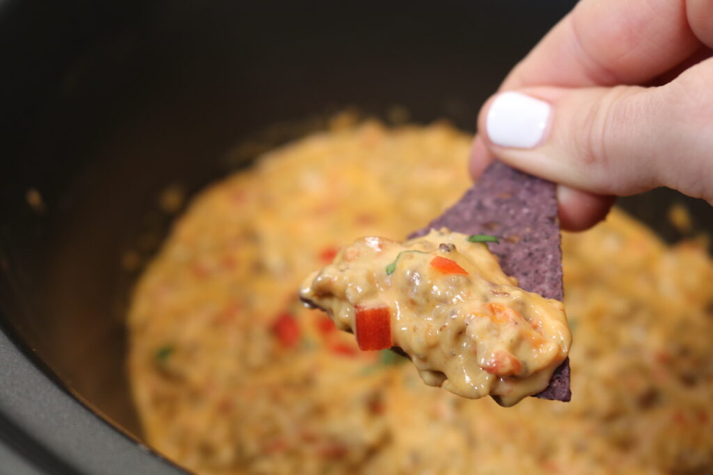 Velveeta Sausage Dip with blue corn chip