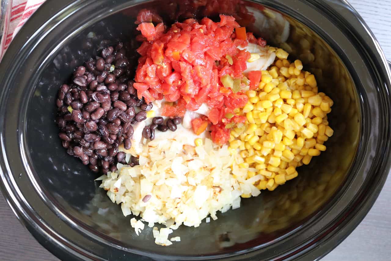 Chicken Thighs, corn, onions, Rotel Tomatoes and black beans in crockpot.