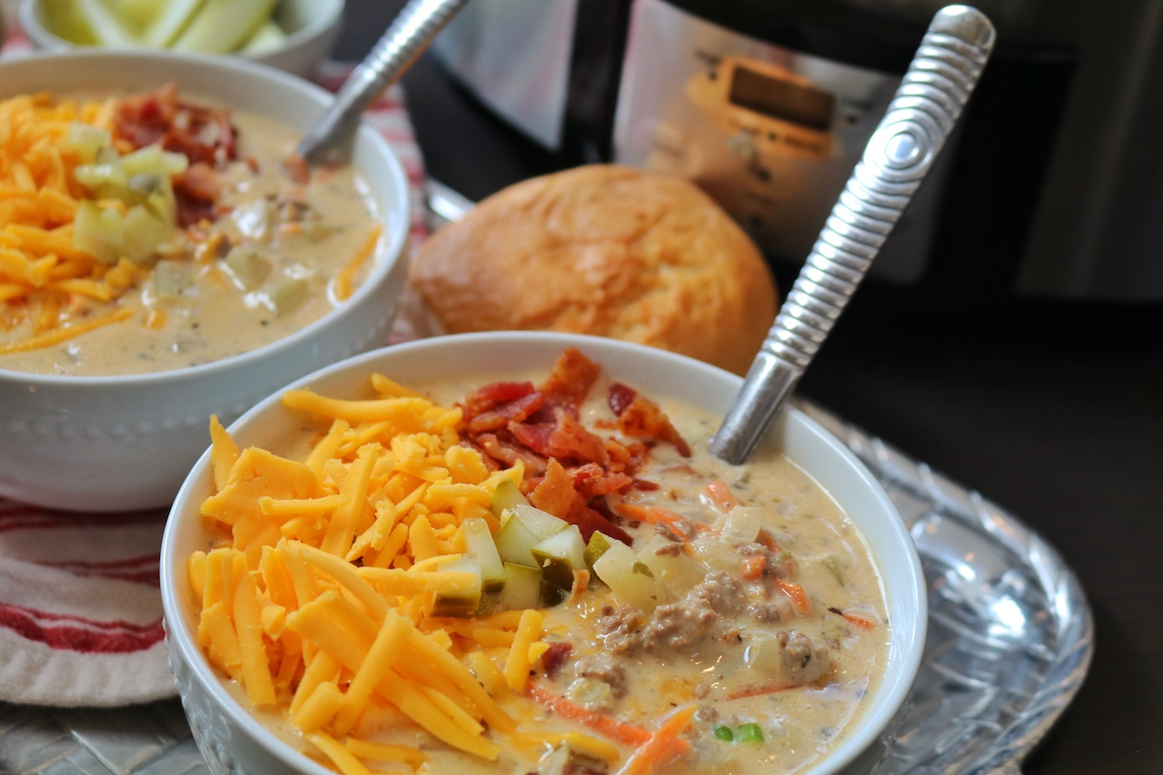 two bowls of Crockpot Cheeseburger Soup with Bacon