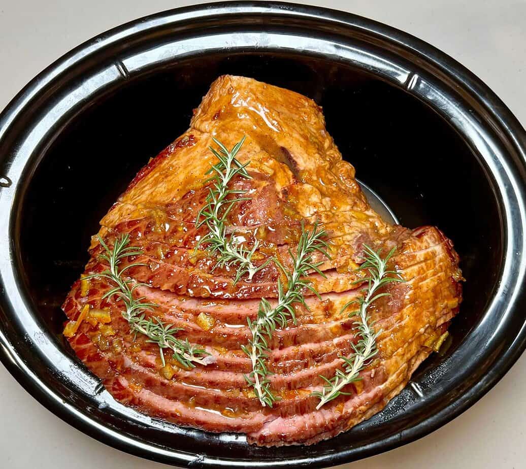 Herbs like rosemary added to slow cooker