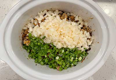 Add the water chestnuts and the green parts of the green onions